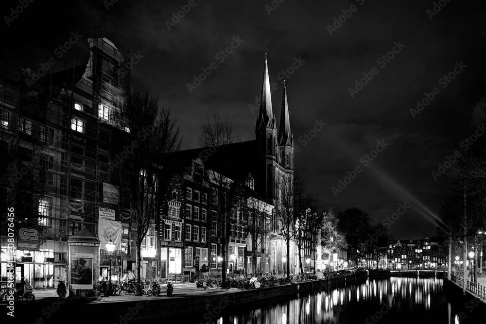 Amsterdam church . spotlight , black and white . dark 