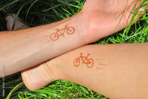 Picture of bikes painted with henna on hand and foot