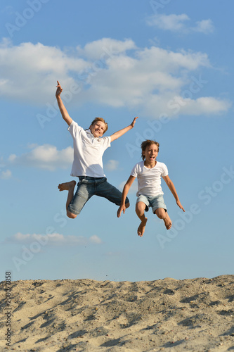 Two boys jumping