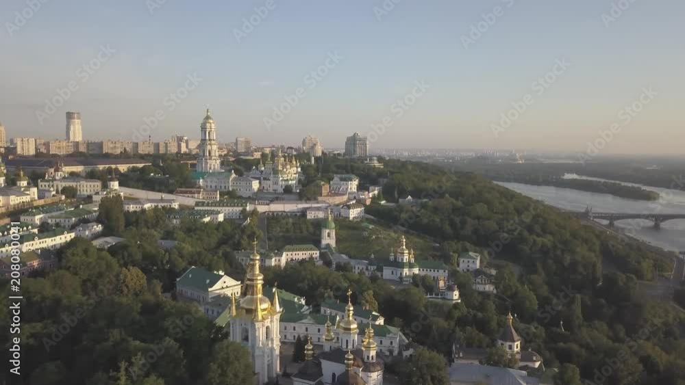 Aerial top panoramic view of Kiev Pechersk Lavra monastery and churches on hills from above at morning sunrise, Kyiv, Ukraine Aerial top panoramic view of Kiev Pechersk Lavra monastery and churches on hills from above at morning sunrise, Kyiv, Ukraine