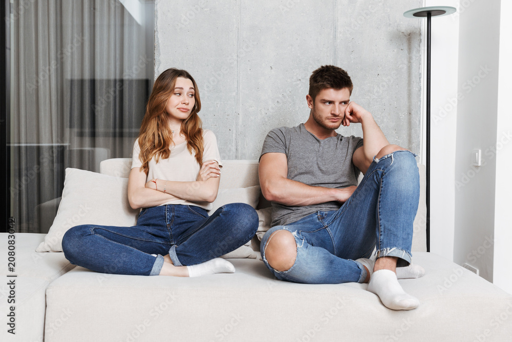 Offended displeased young loving couple Offended displeased young loving couple