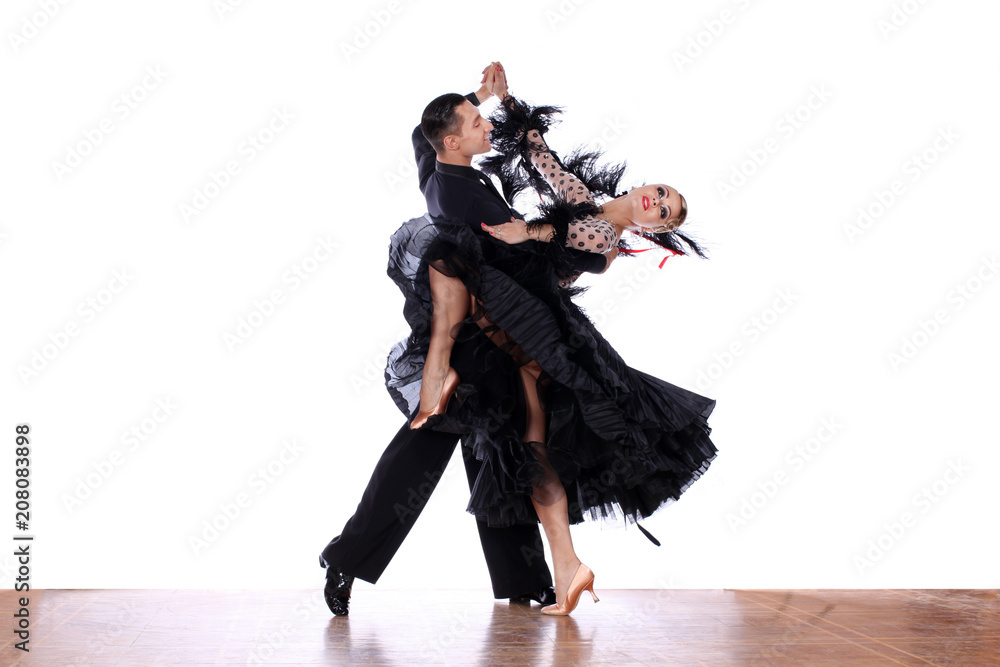 Fototapeta premium Latino dancers in ballroom against white background