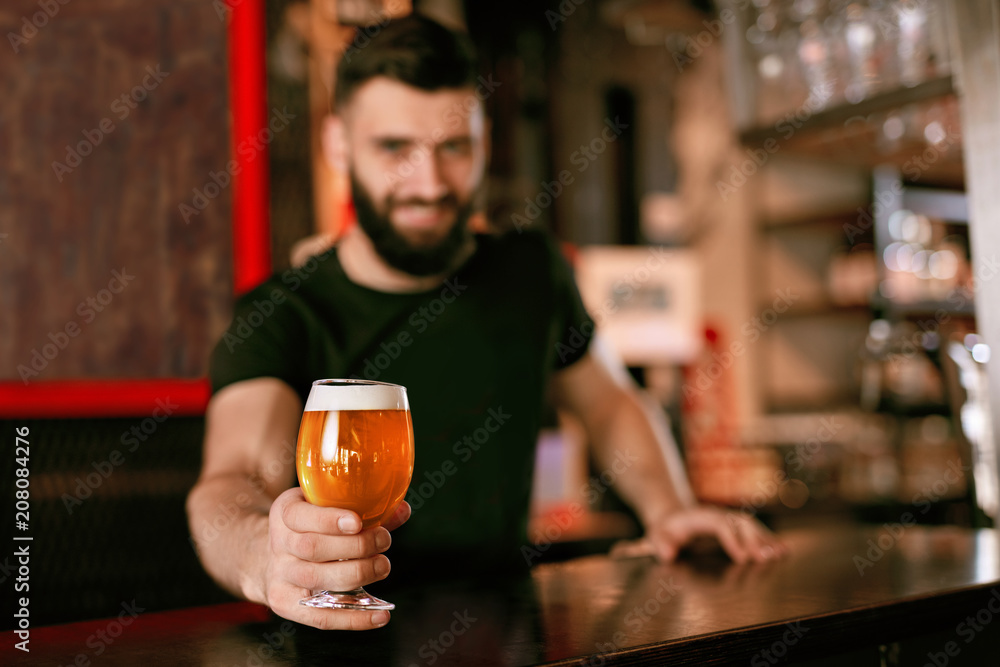 Craft Beer. Man Holding Glass With Beer In Pub Craft Beer. Man Holding Glass With Beer In Pub