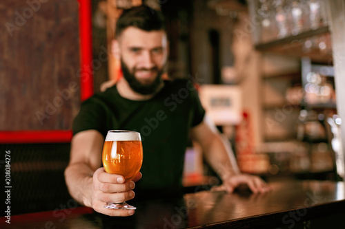 Craft Beer. Man Holding Glass With Beer In Pub