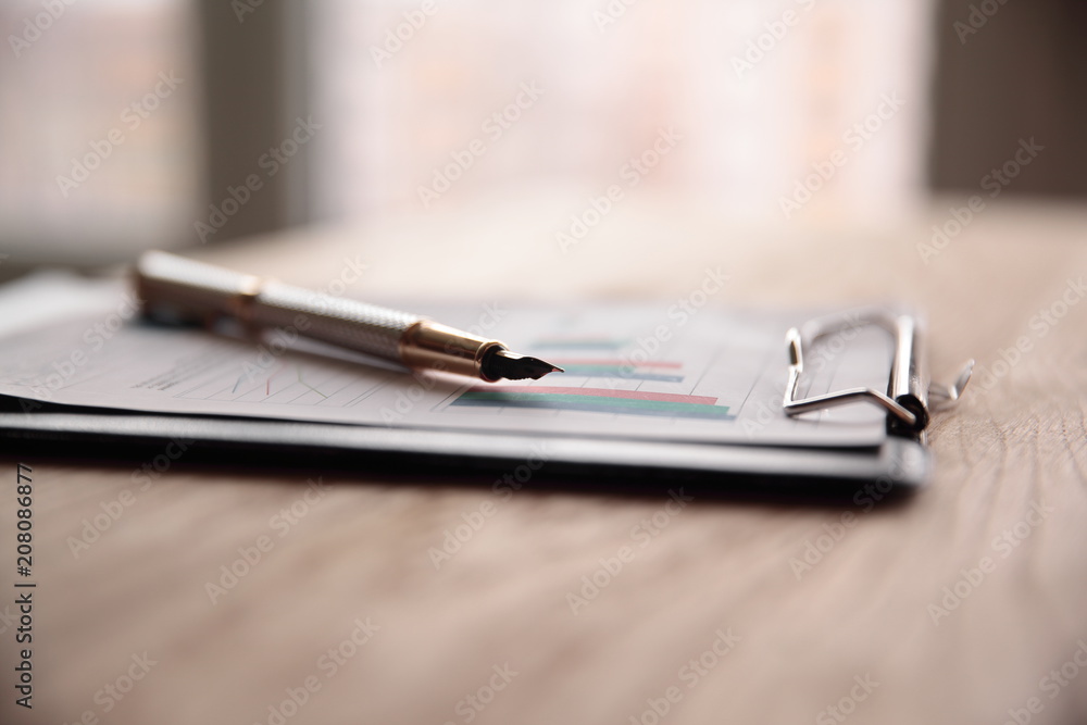 close up.pen and clipboard on the desktop .photo with copy space close up.pen and clipboard on the desktop .photo with copy space