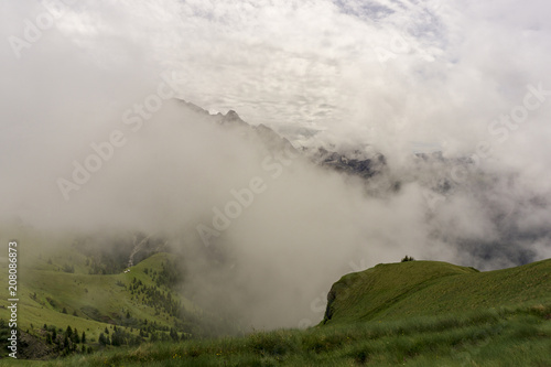 A cloudy beautiful landscape of the Dolomites in June. Italy. © Jacek Jacobi
