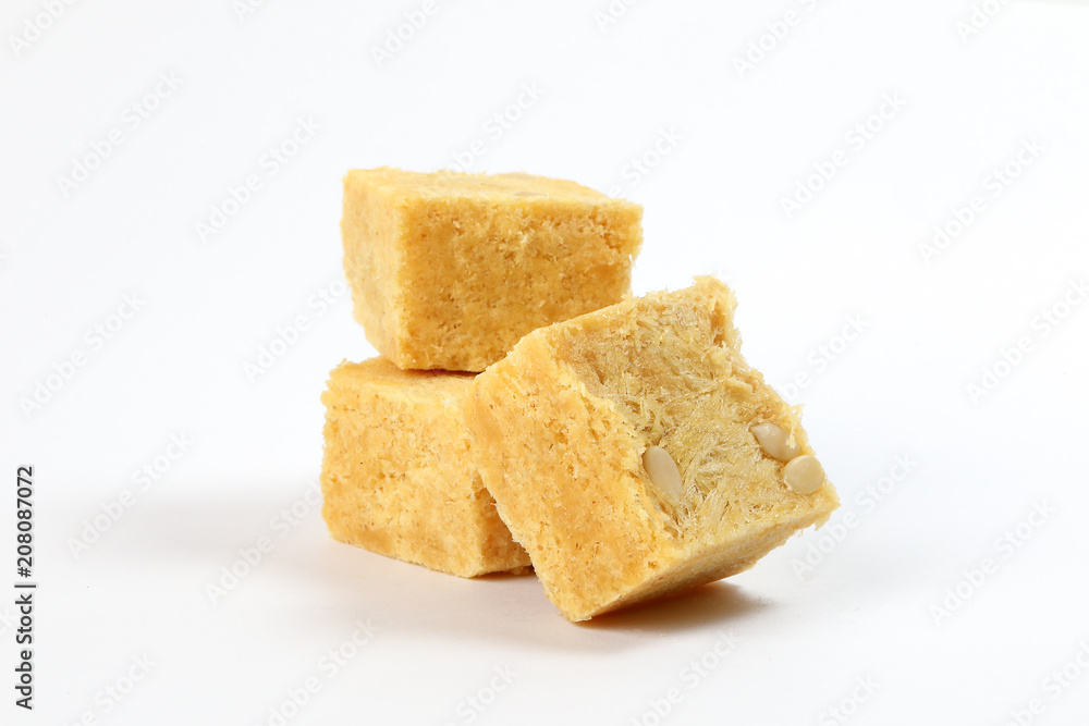 Flaky sweet Soan papdi patisa son papri sohan papdi shonpapri on white background Flaky sweet Soan papdi patisa son papri sohan papdi shonpapri on white background