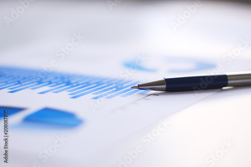 business background: financial chart and pen on office workplace © yurolaitsalbert