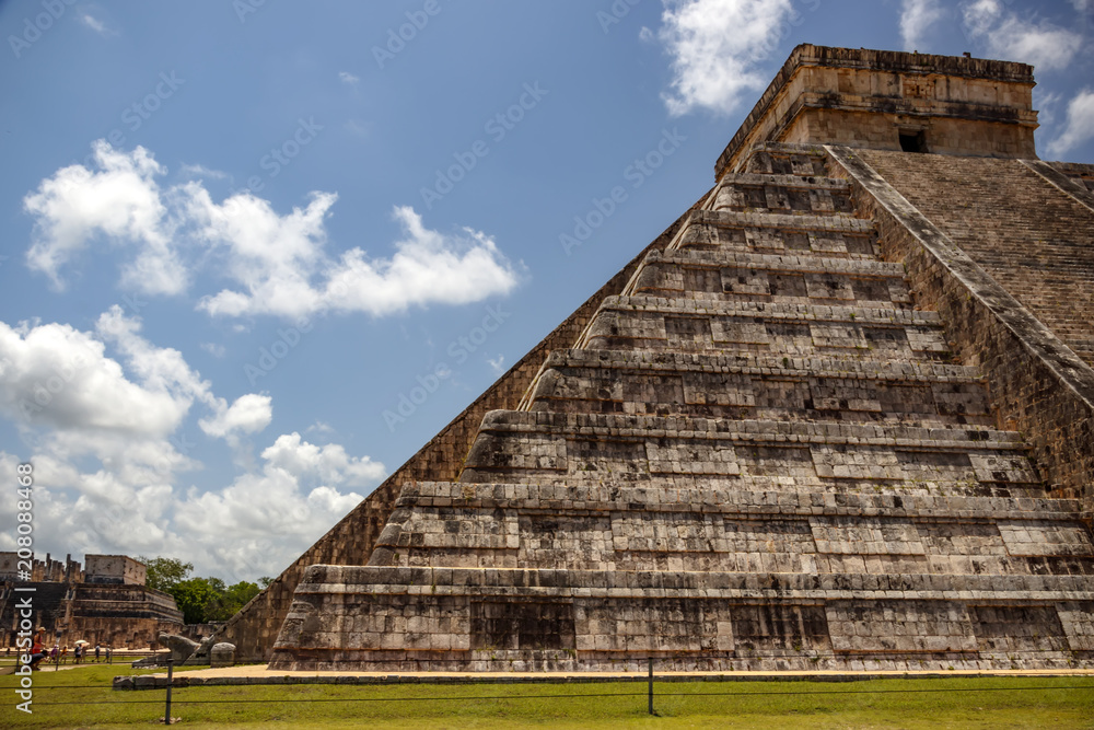 Side view of the nine steps of the Mayan pyramid with God feathered serpent mayan kukulkan quetzalcoatl . Chichen Itza. Mexico Side view of the nine steps of the Mayan pyramid with God feathered serpent mayan kukulkan quetzalcoatl . Chichen Itza. Mexico