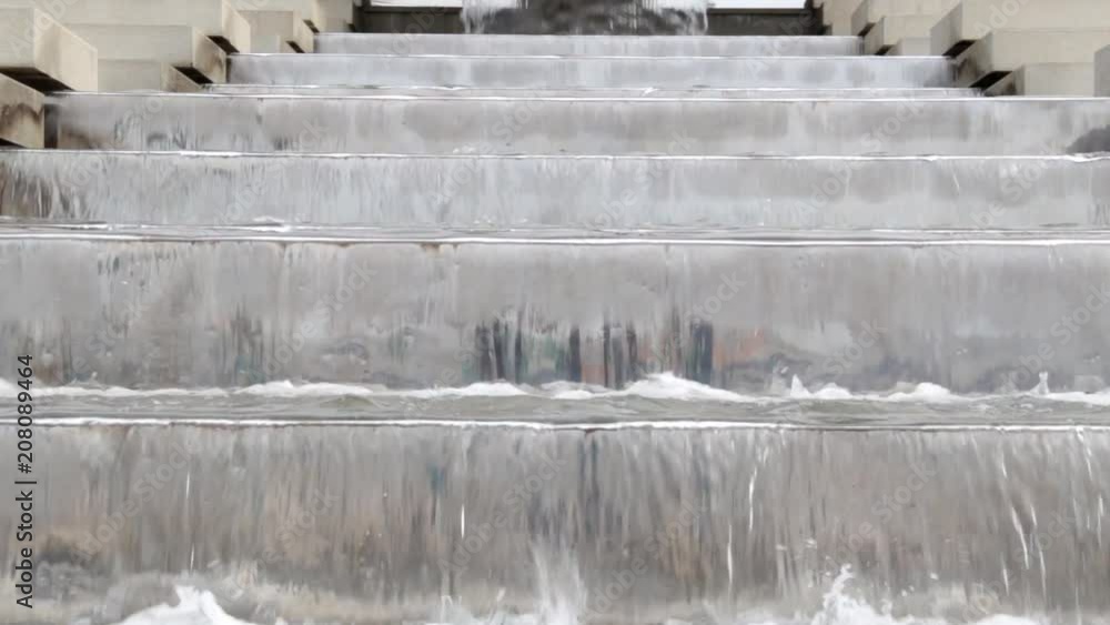 Beautiful cascading waterfall fountain. Water flows on the steps. Beautiful cascading waterfall fountain. Water flows on the steps.