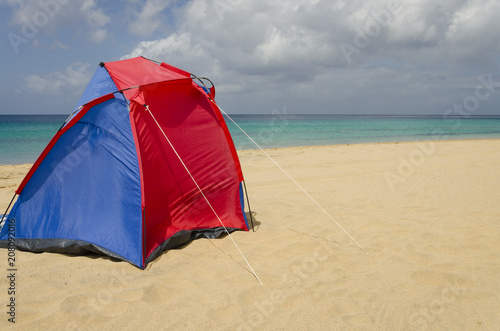 A colorful tent on the beach © Eva Alex