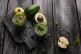 Organic fruit smoothie with avocado on wooden background