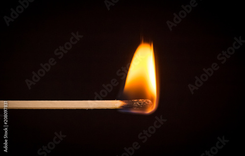 Photo of burning matchstick. photo