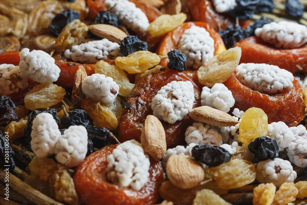 Fototapeta premium Assortment of dried fruits: peach, apricot, white and black grapes