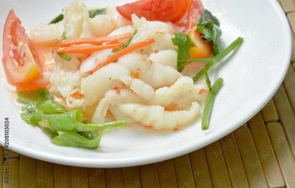 spicy chicken foot with chili and lime salad on white plate spicy chicken foot with chili and lime salad on white plate
