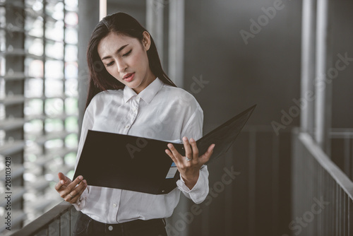 business black woman holding files
