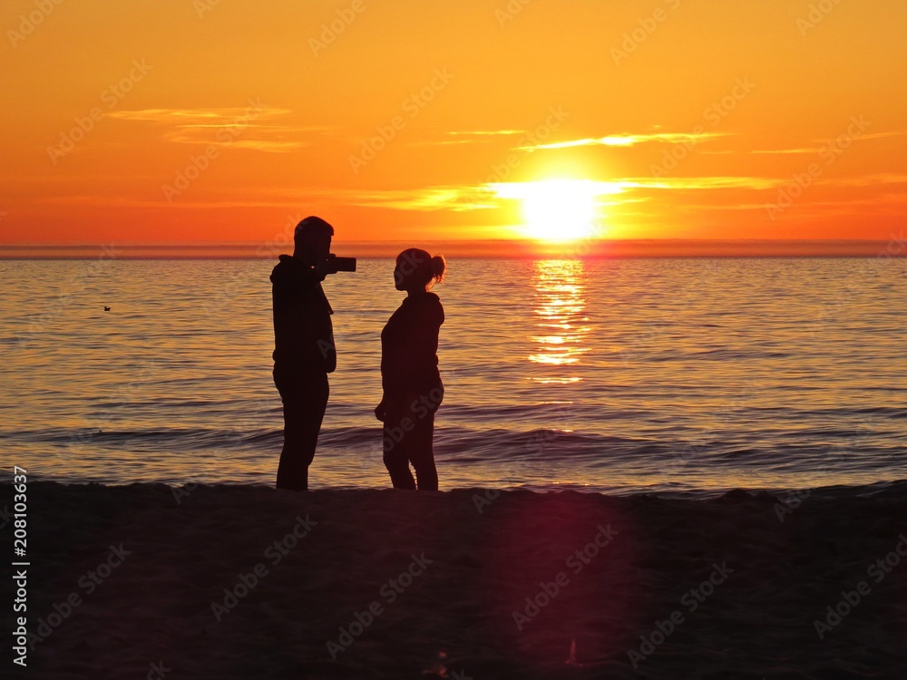 Couple in Love on Sand Beach Seaside during Romantic Sunset
