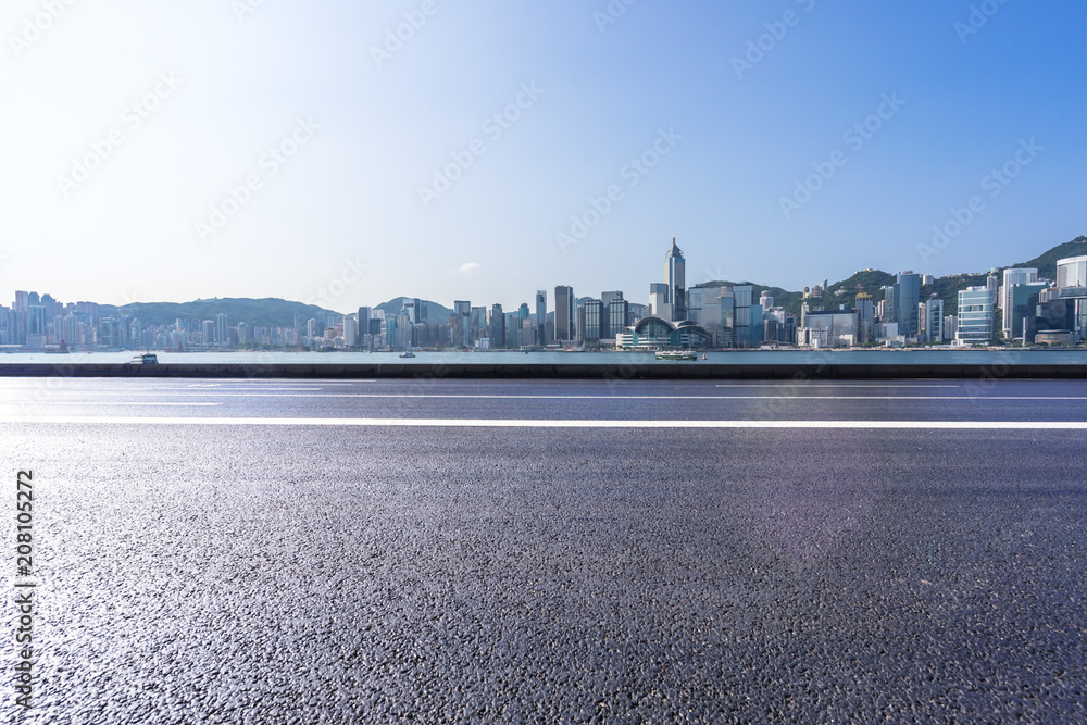 city skyline with asphalt road