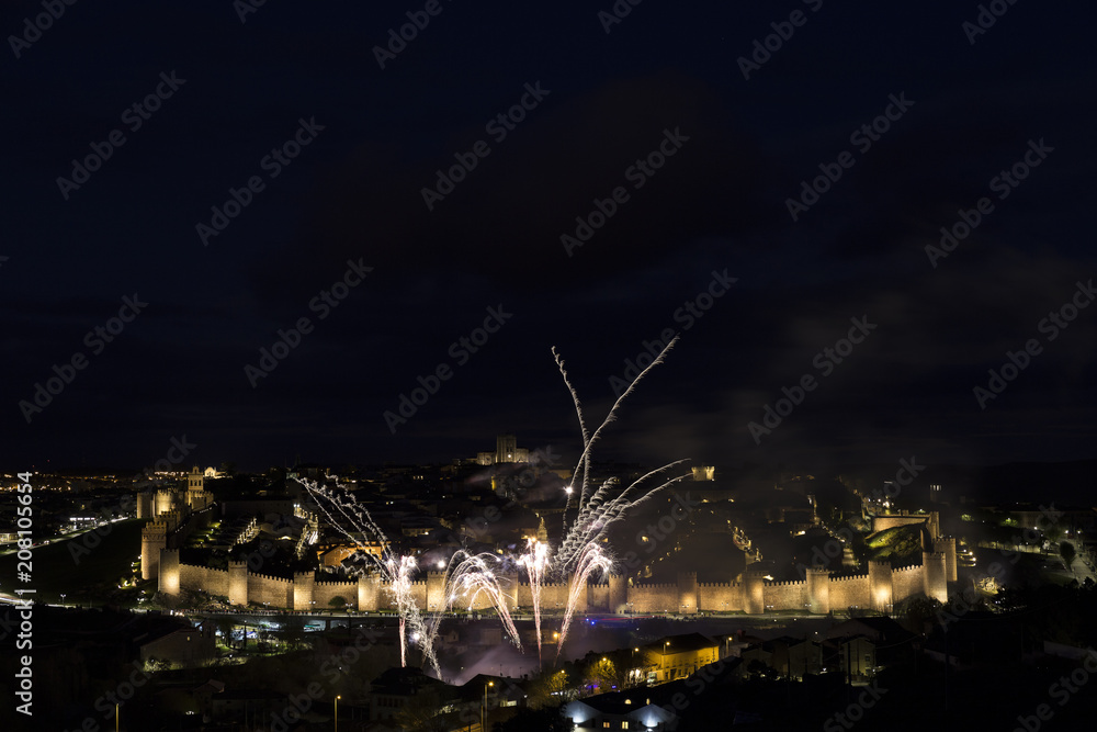 night views of fireworks in the city of Avila in Spain, medieval walled city perfectly preserved

