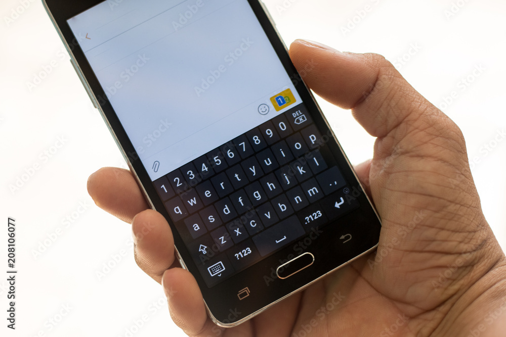 smart phon and hand touch on keypad smart phon and hand touch on keypad