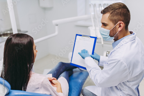 doctor showing dental results to patient
