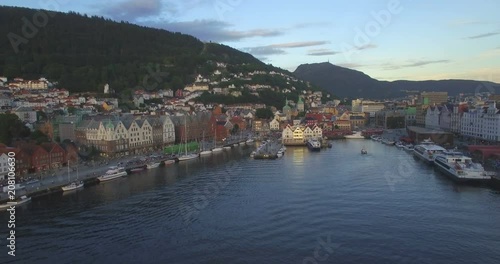 Aerial view across VÎgen harbour to Mount Ulriken above historic medieval wooden Hanseatic buildings in the old harbour district of Bryggen, Bergen, Hordaland, Norway  photo