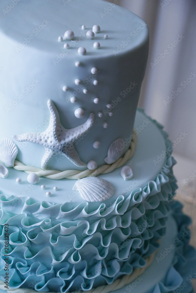Foto Stock Dettaglio marinaro con stella di mare di torta color celeste |  Adobe Stock