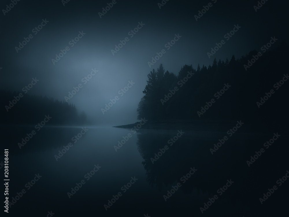 Obraz premium dark moody landscape of a lake and forest