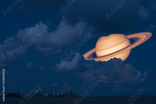 Fototapeta Naklejka Na Ścianę i Meble -  Saturn back night cloud sunset on the sea ,concept Saturn near Earth
