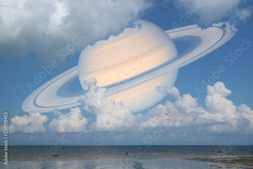 Fototapeta Naklejka Na Ścianę i Meble -  Saturn back cloud  sky on sea ,concept Saturn near Earth