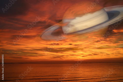 Fototapeta Naklejka Na Ścianę i Meble -  Saturn back night cloud sunset sky on sea ,concept Saturn near Earth