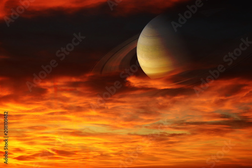 Fototapeta Naklejka Na Ścianę i Meble -  Saturn back sunset hot red orange cloud ,concept Saturn near Earth