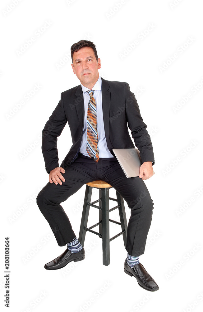 Business man sitting with laptop in hand Business man sitting with laptop in hand