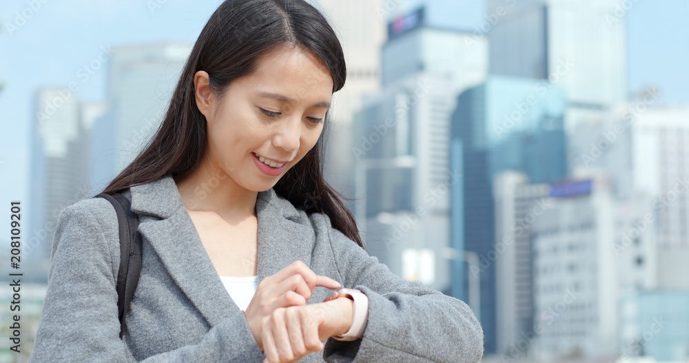 Woman using smart watch for check appointment Woman using smart watch for check appointment