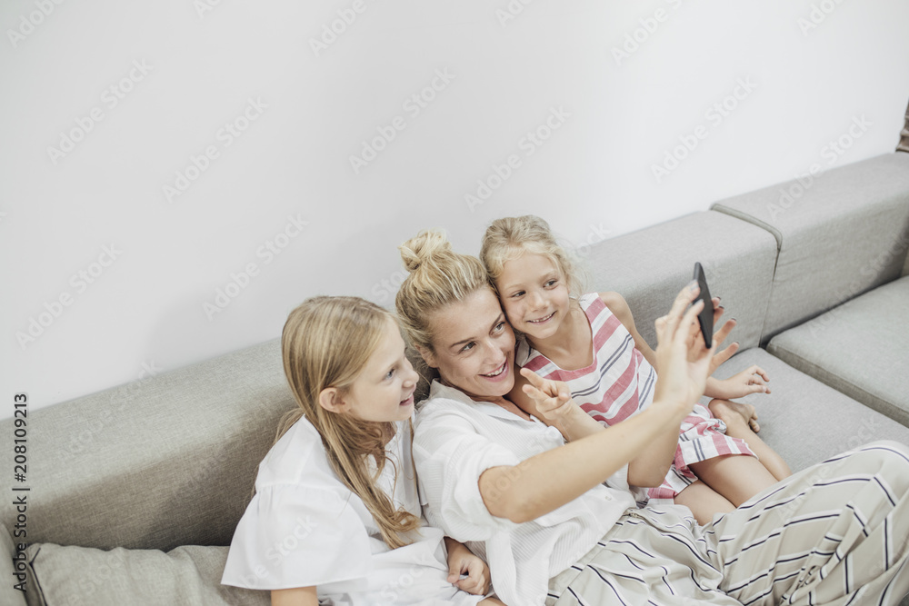 Mom and Daughters Taking Selfie