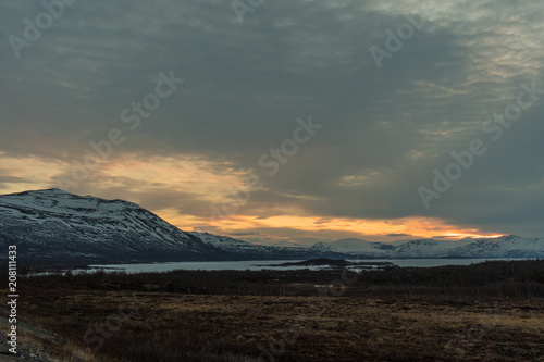 The frozen Tornetr  sk Lake in the Abisko National Park at sunset   Lapland  Sweden