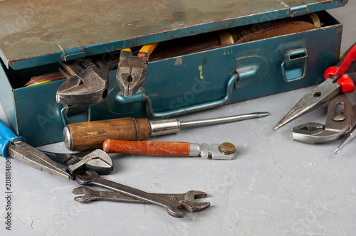 Set of different construction vintage tools and instruments for household with old iron box