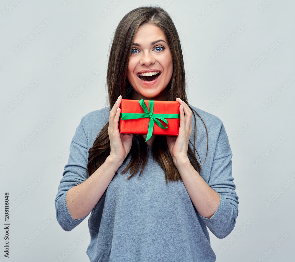 Happy smiling woman holding little red gift box. Happy smiling woman holding little red gift box.
