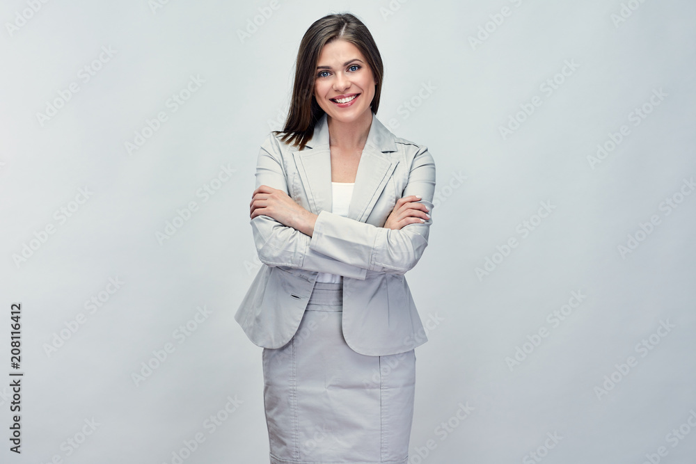 Smiling business woman in suit with crossed arms. Smiling business woman in suit with crossed arms.