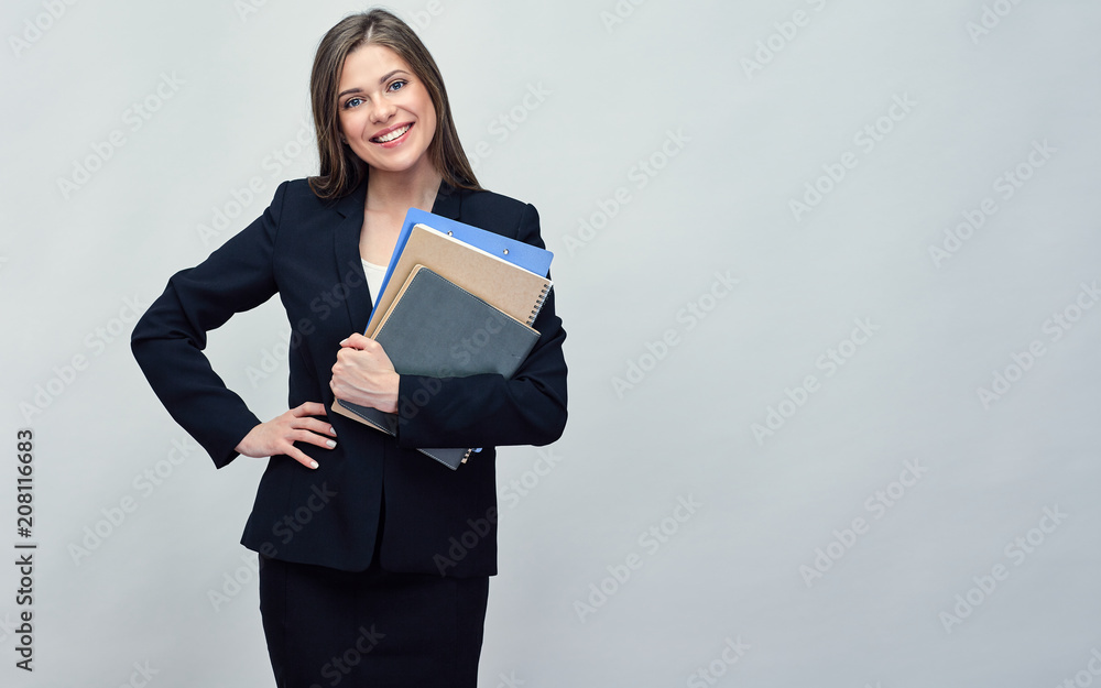 Smiling woman in black suit holding book and business paper. Smiling woman in black suit holding book and business paper.