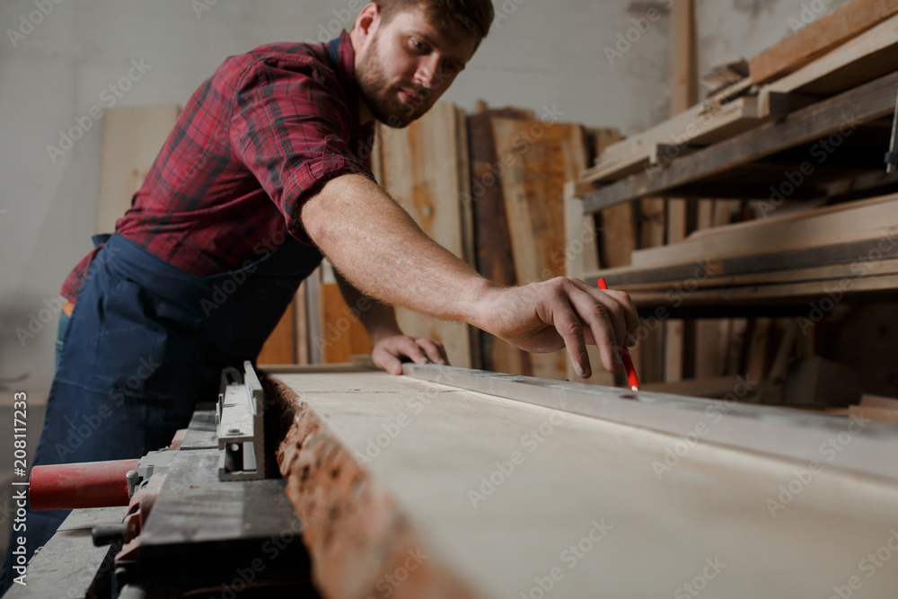 Portrait Male Master carpenter apron in his workshop. Small business Portrait Male Master carpenter apron in his workshop. Small business