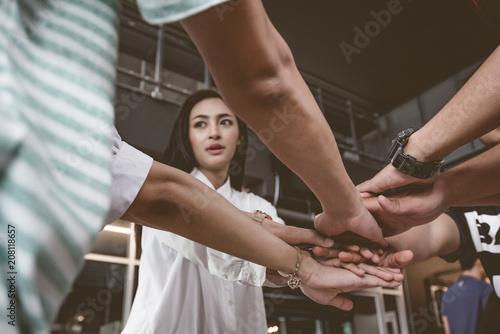 success and winning concept - happy business team celebrating victory in office