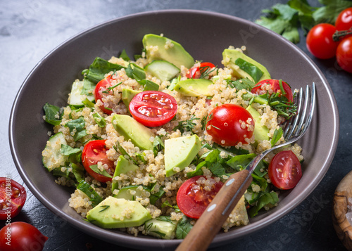 Quinoa salad with spinach, avocado and tomatoes