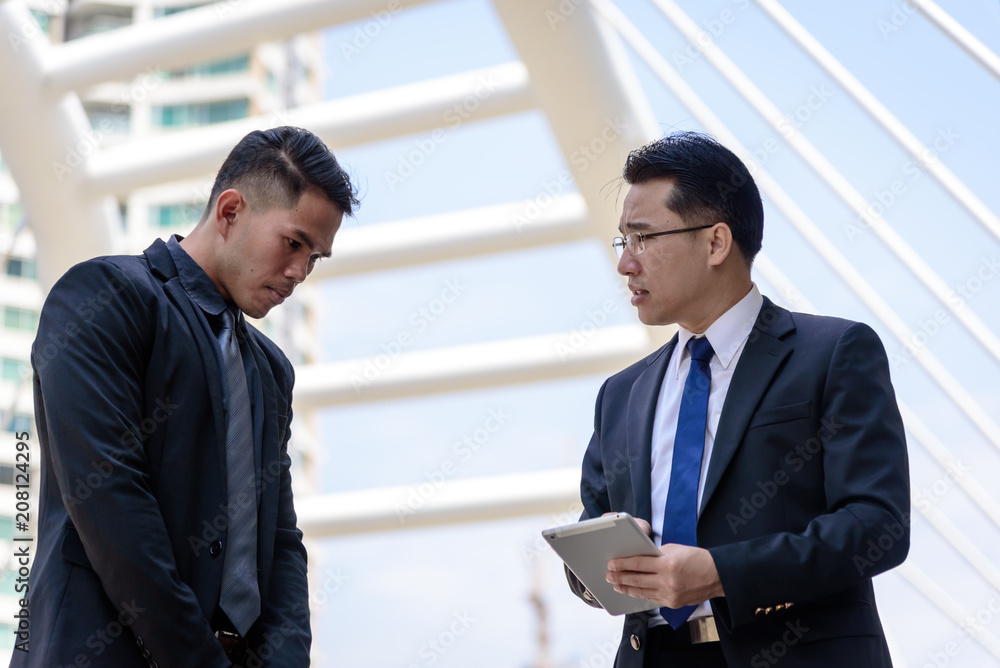 Two asian businessman has talking for business vision. Two asian businessman has talking for business vision.