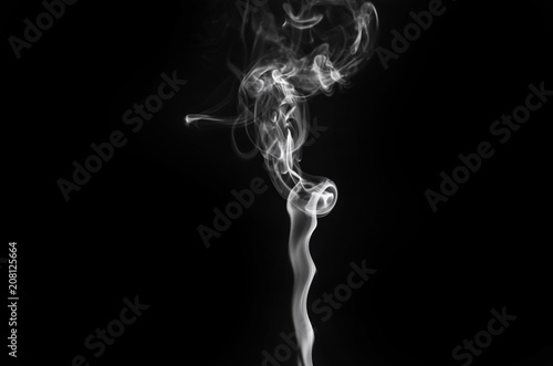 abstract beautiful fragment movement of burn white smoke on black background.