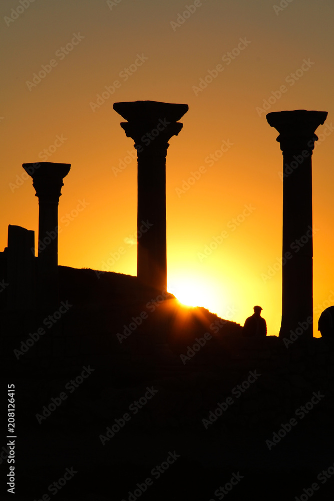 Fototapeta premium Beautiful sunset with silhouette of ancient columns at Chersonese of Taurida, Crimea.