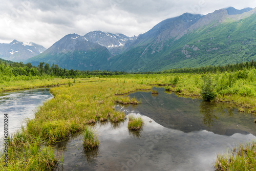 Mountain Peaks Reflected in Alaska's Eagle River © Matt
