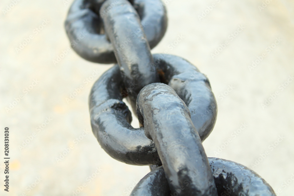 Black thick steel chain. Chain for fencing. Close-up. Background. Black thick steel chain. Chain for fencing. Close-up. Background.