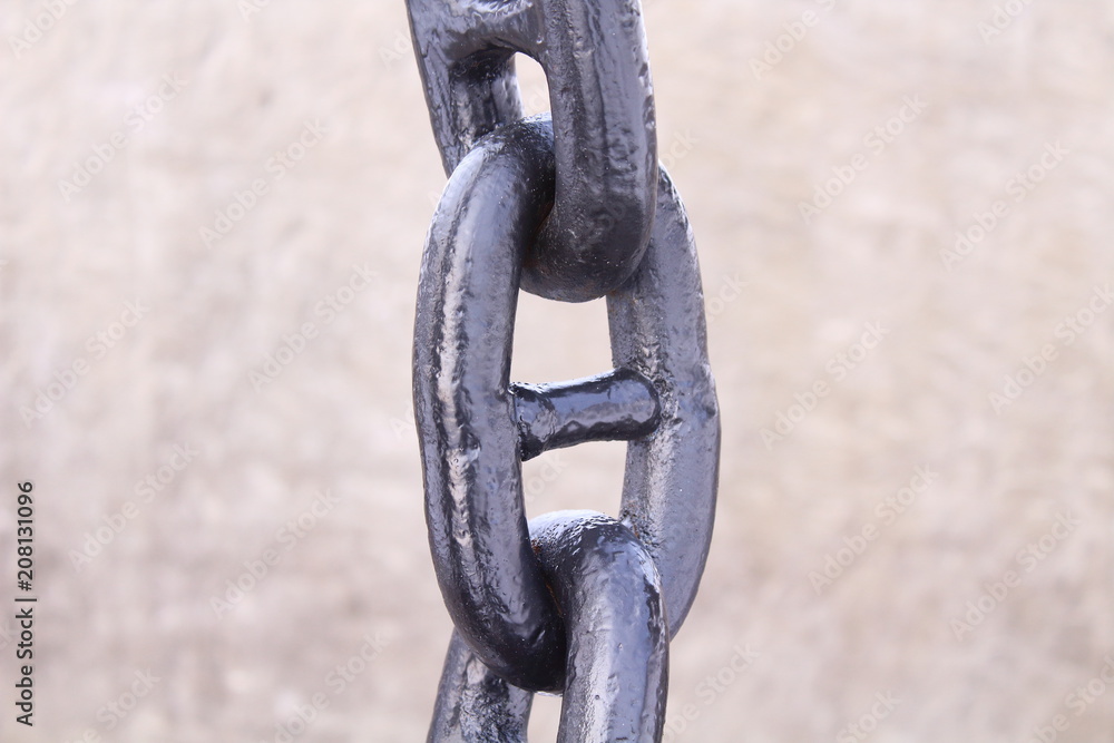Black thick steel chain. Chain for fencing. Close-up. Background. Black thick steel chain. Chain for fencing. Close-up. Background.