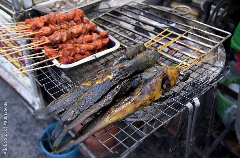 Roasted chicken liver and catfish grilled on the grille Local dishes   market of popular eaten with sticky rice in thailand